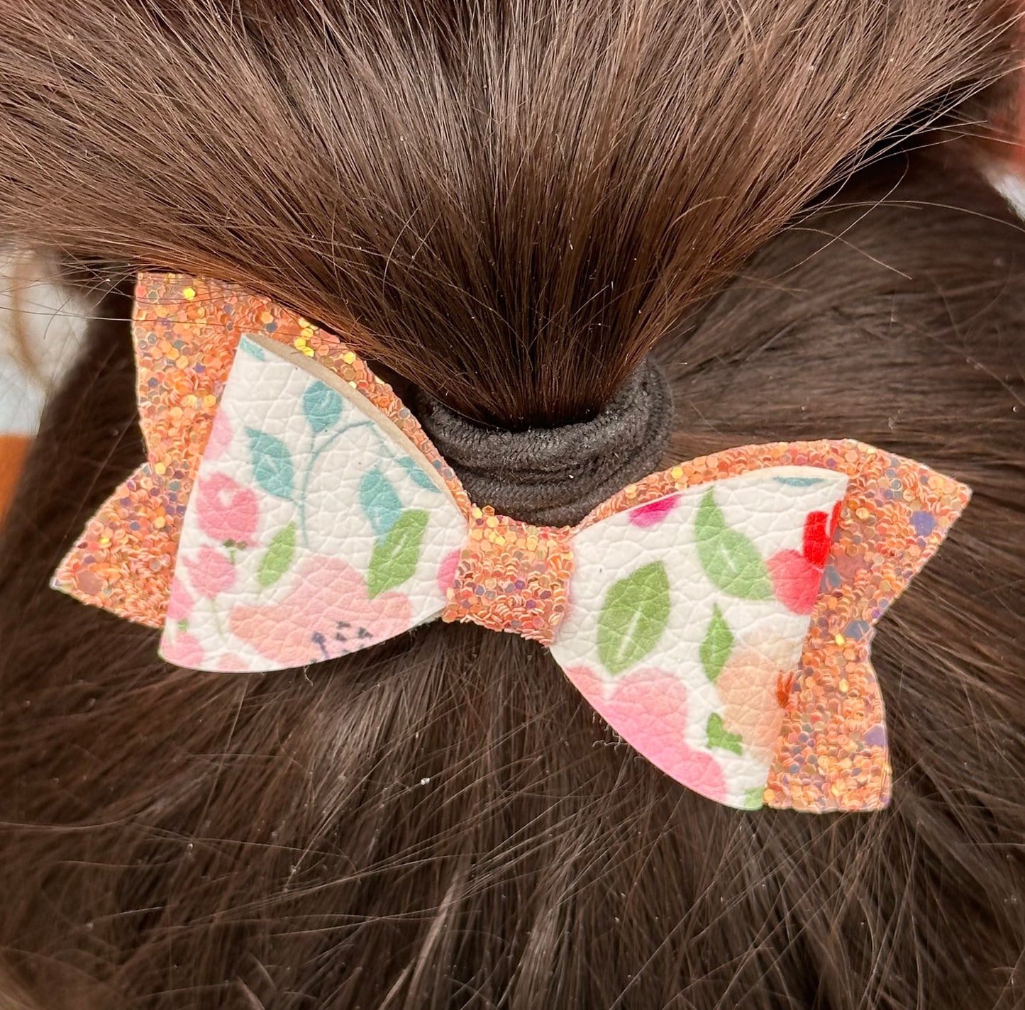Peach flowers on white and peach glitter bow