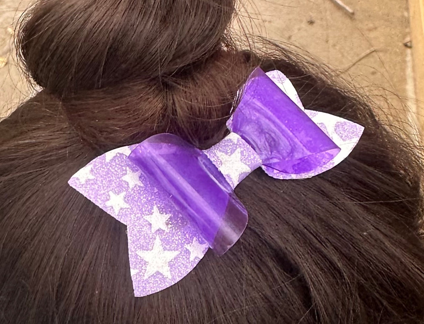 Purple star glow in the dark bow