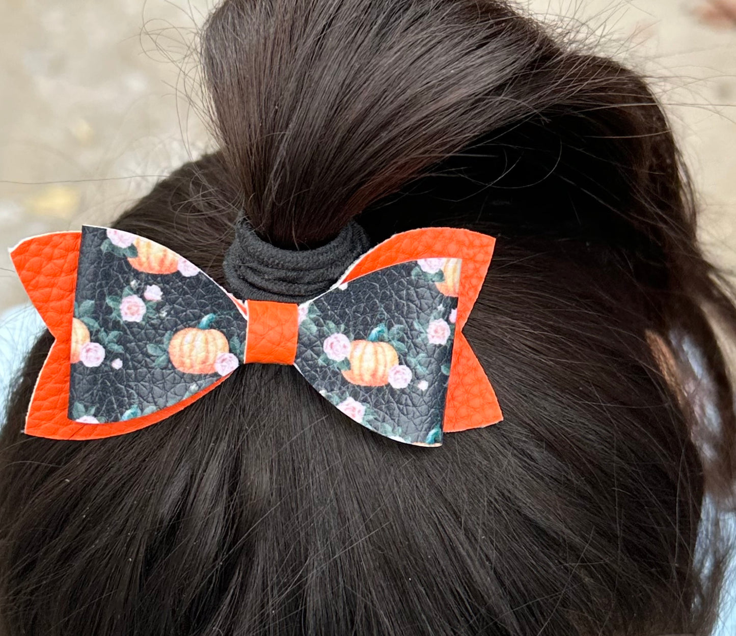 Pumpkins and flowers on black and orange hair bow