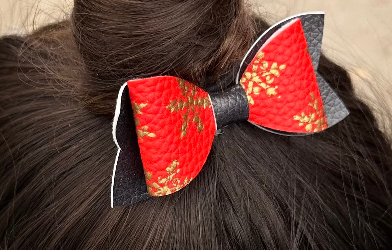 Gold snowflakes on red and black hairbow