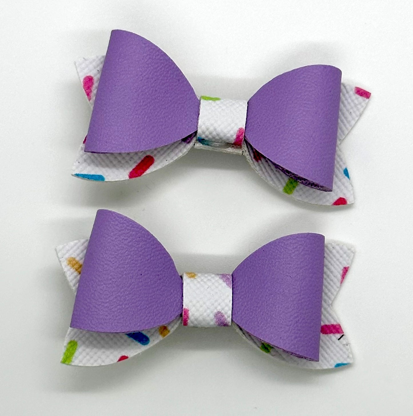 Purple on multicolored sprinkles 2pcs mini bows