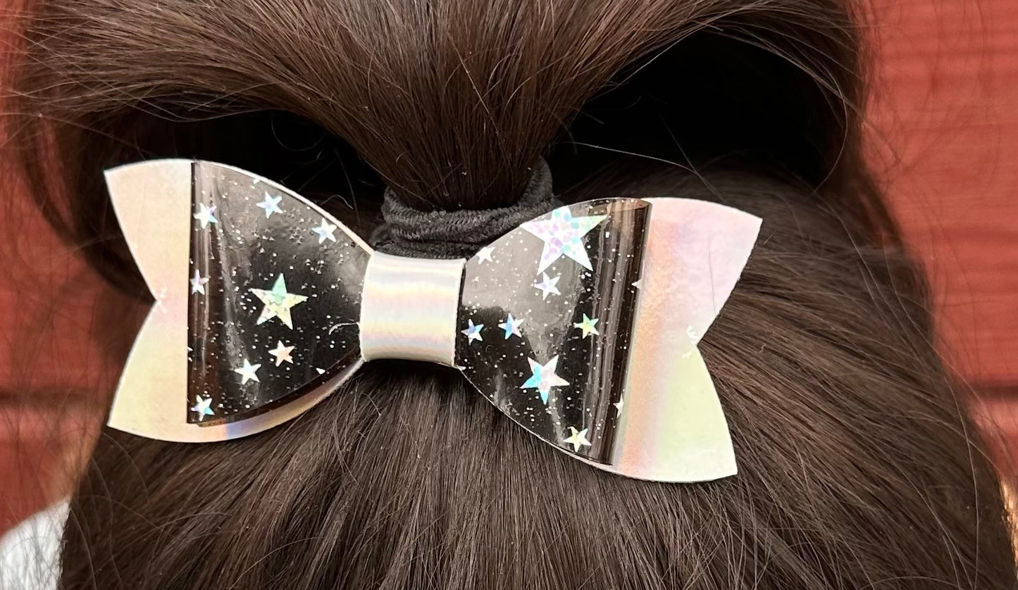 Silver stars on black on holographic bow