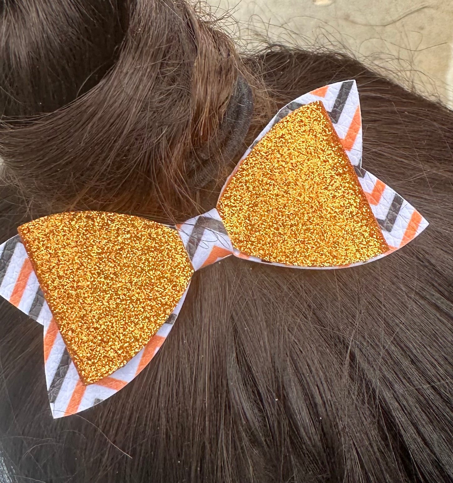 Orange glitter on orange black and white chevron bow