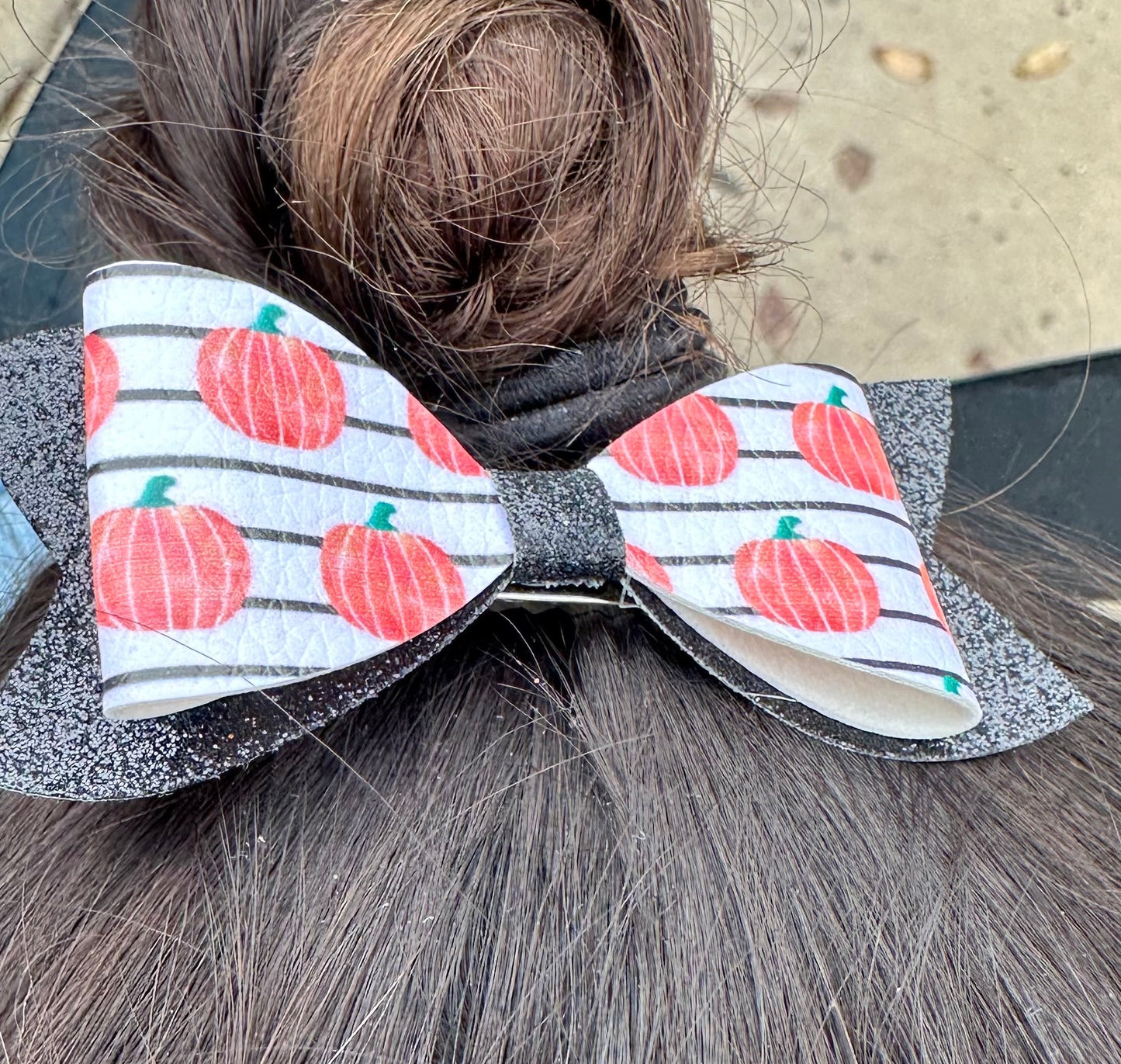 Pumpkins on black and white stripes bow