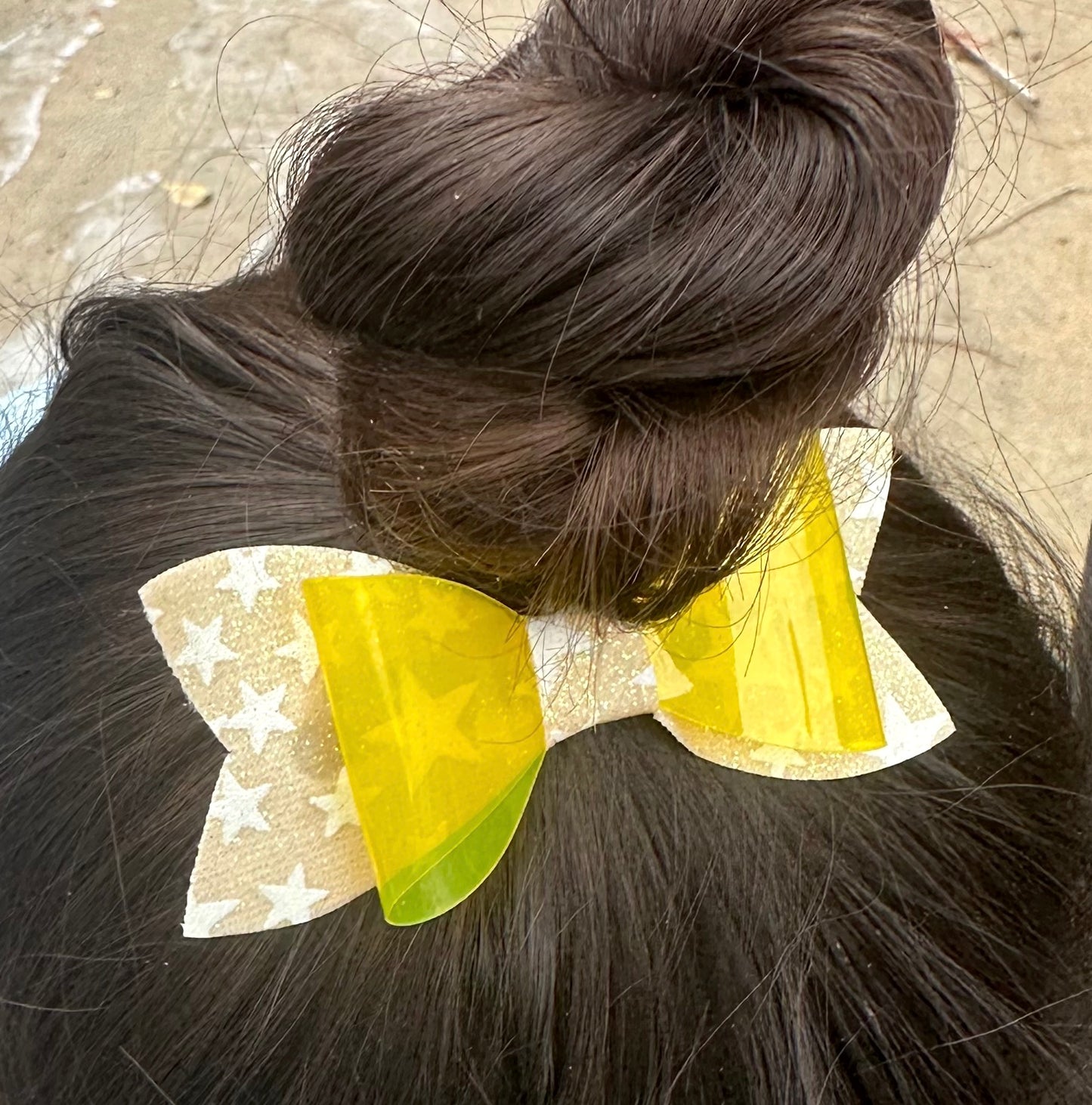 Yellow star glow in the dark bow