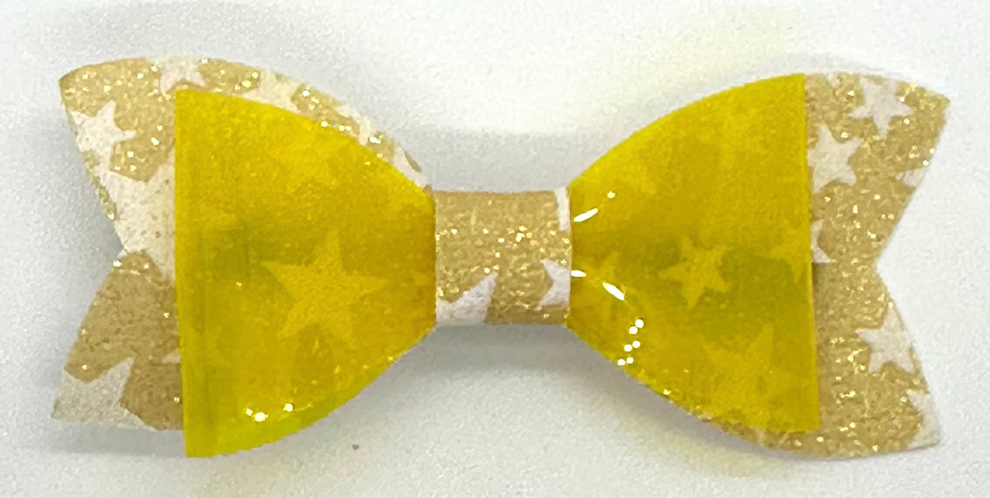 Yellow star glow in the dark bow