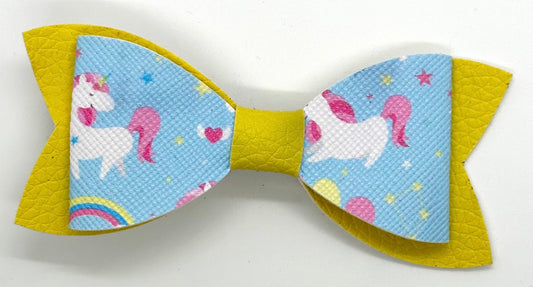 Unicorns on blue and yellow bow