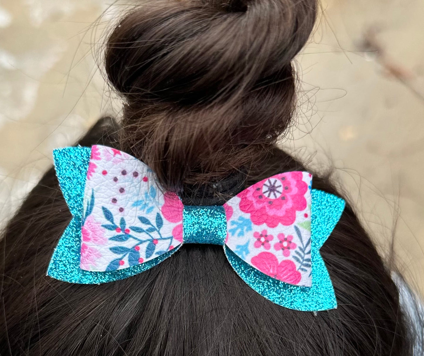 Pink flowers on blue glitter bow