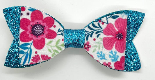 Pink flowers on blue glitter bow