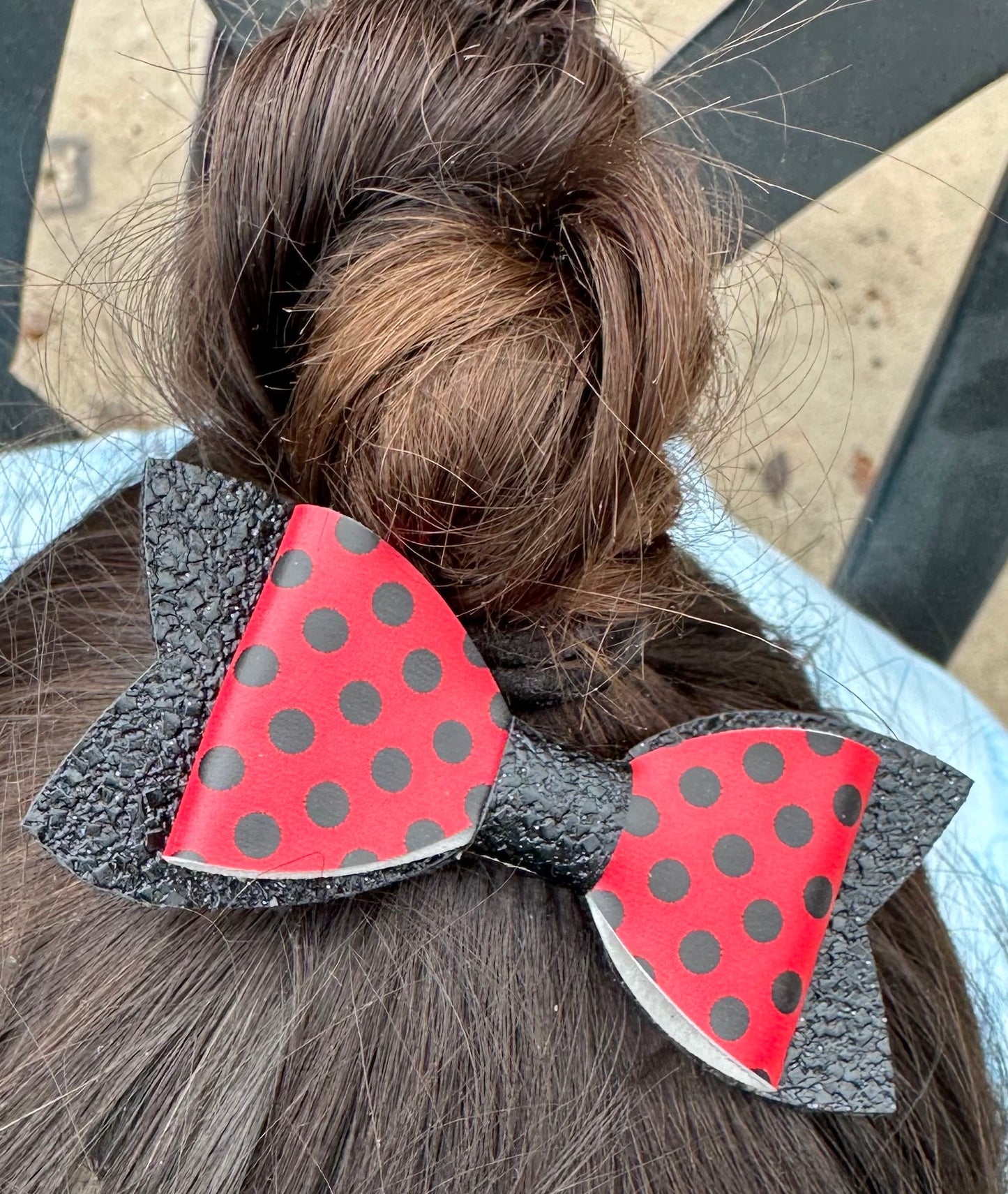 Red with black polka dots on black glitter bow