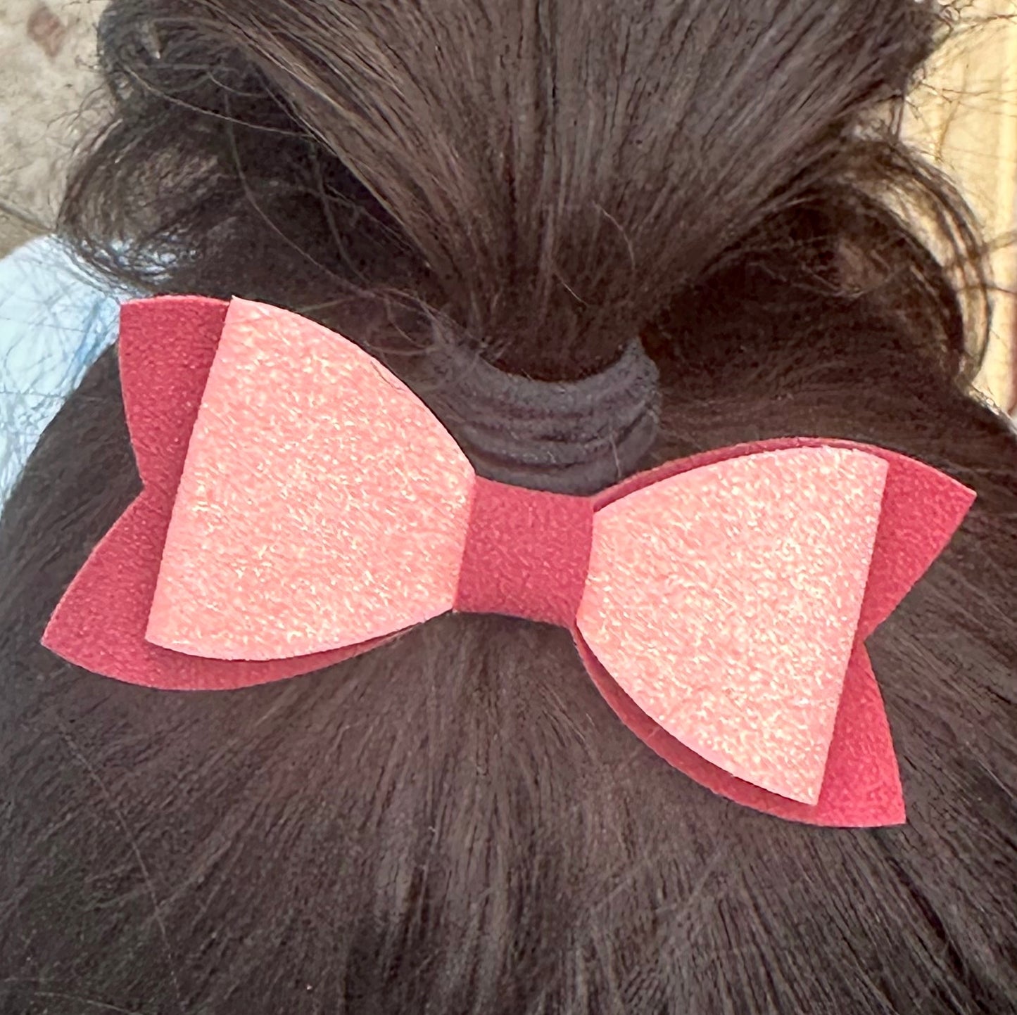 Pink glitter on burgundy faux suede bow