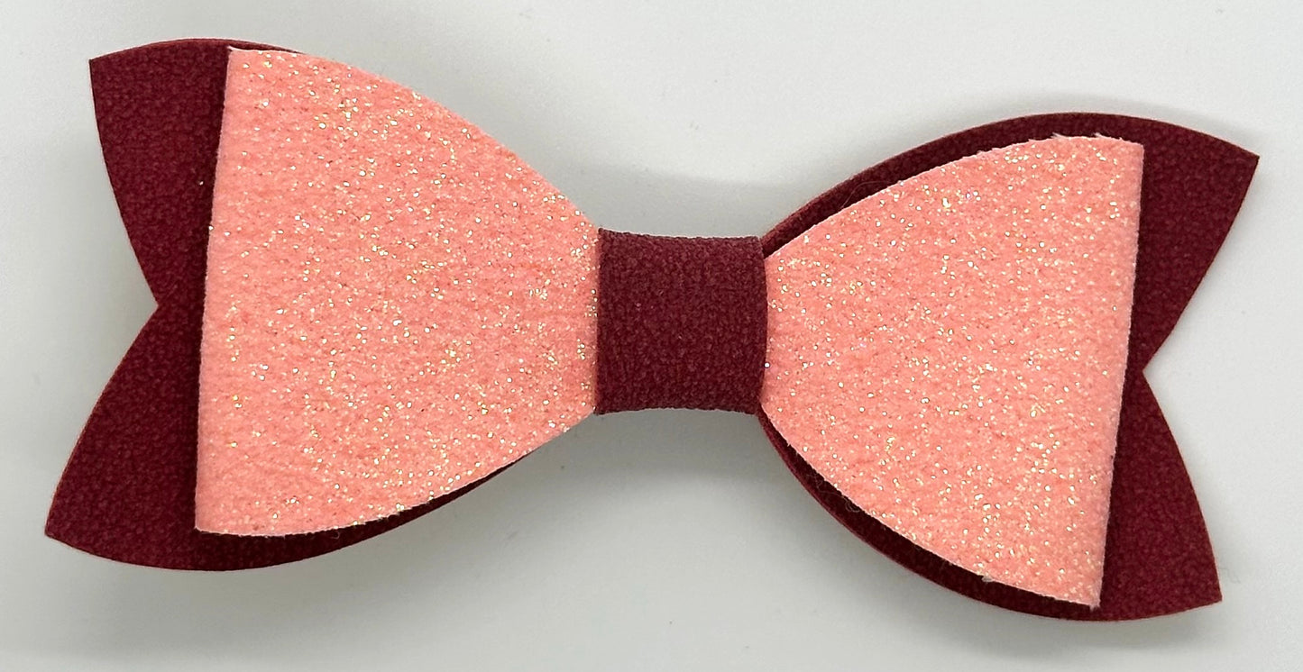 Pink glitter on burgundy faux suede bow