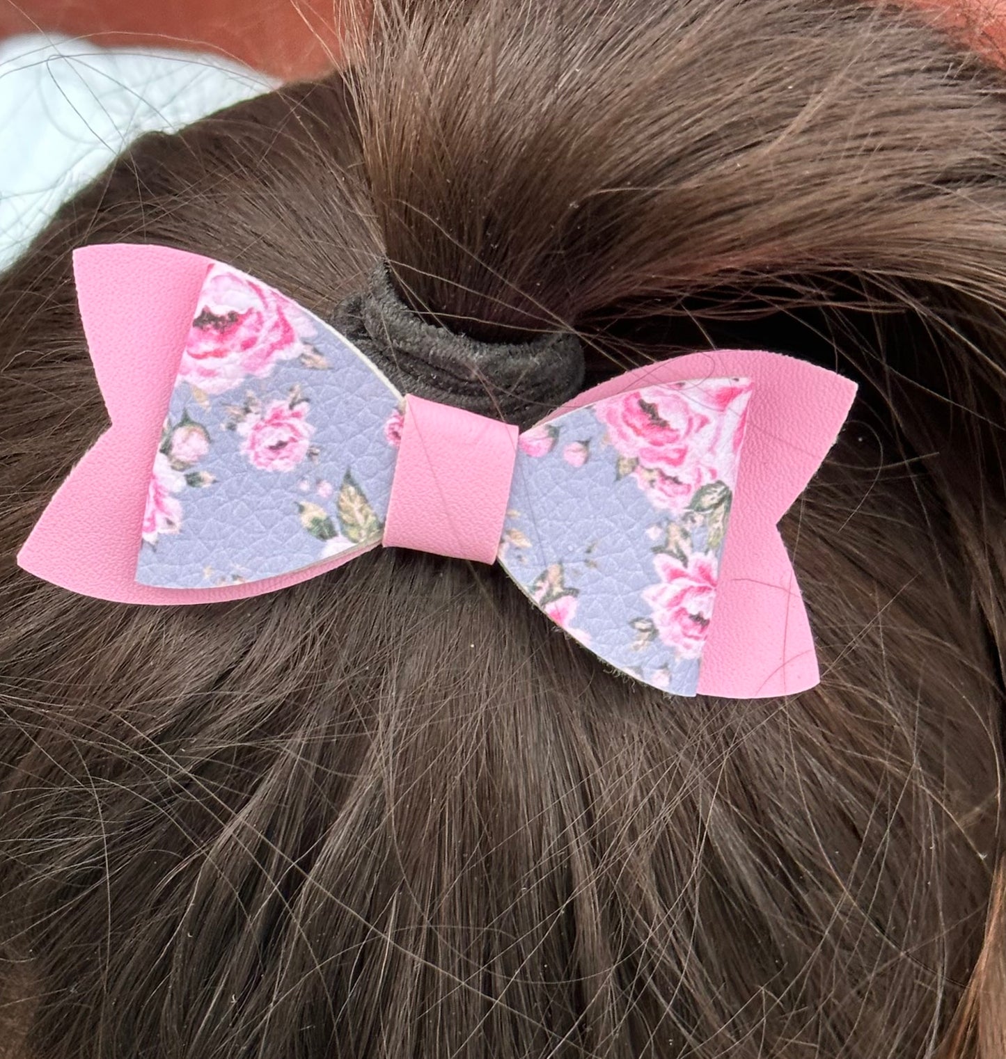 Pink roses on gray and pink bow