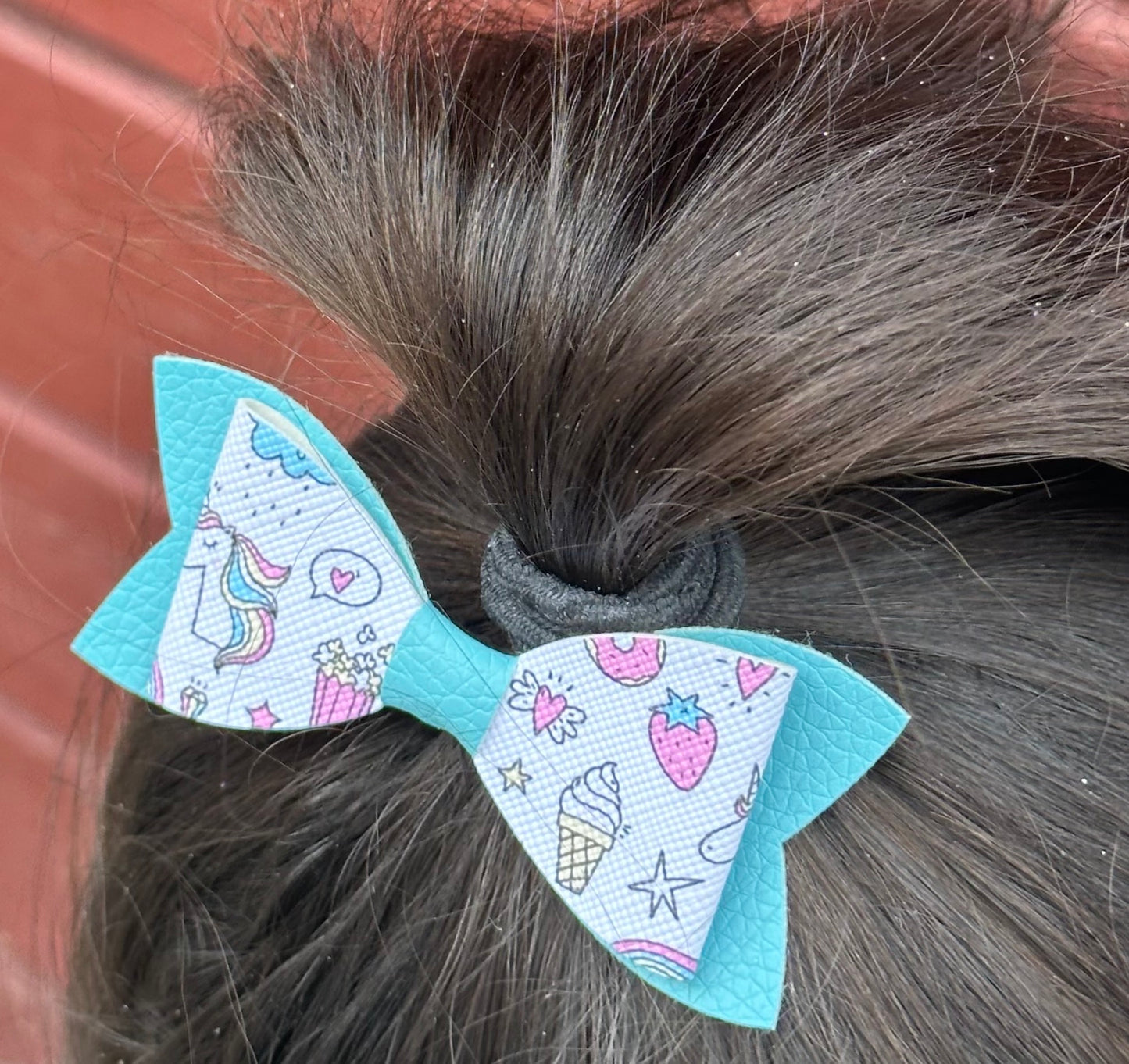 Unicorns and snacks on blue bow