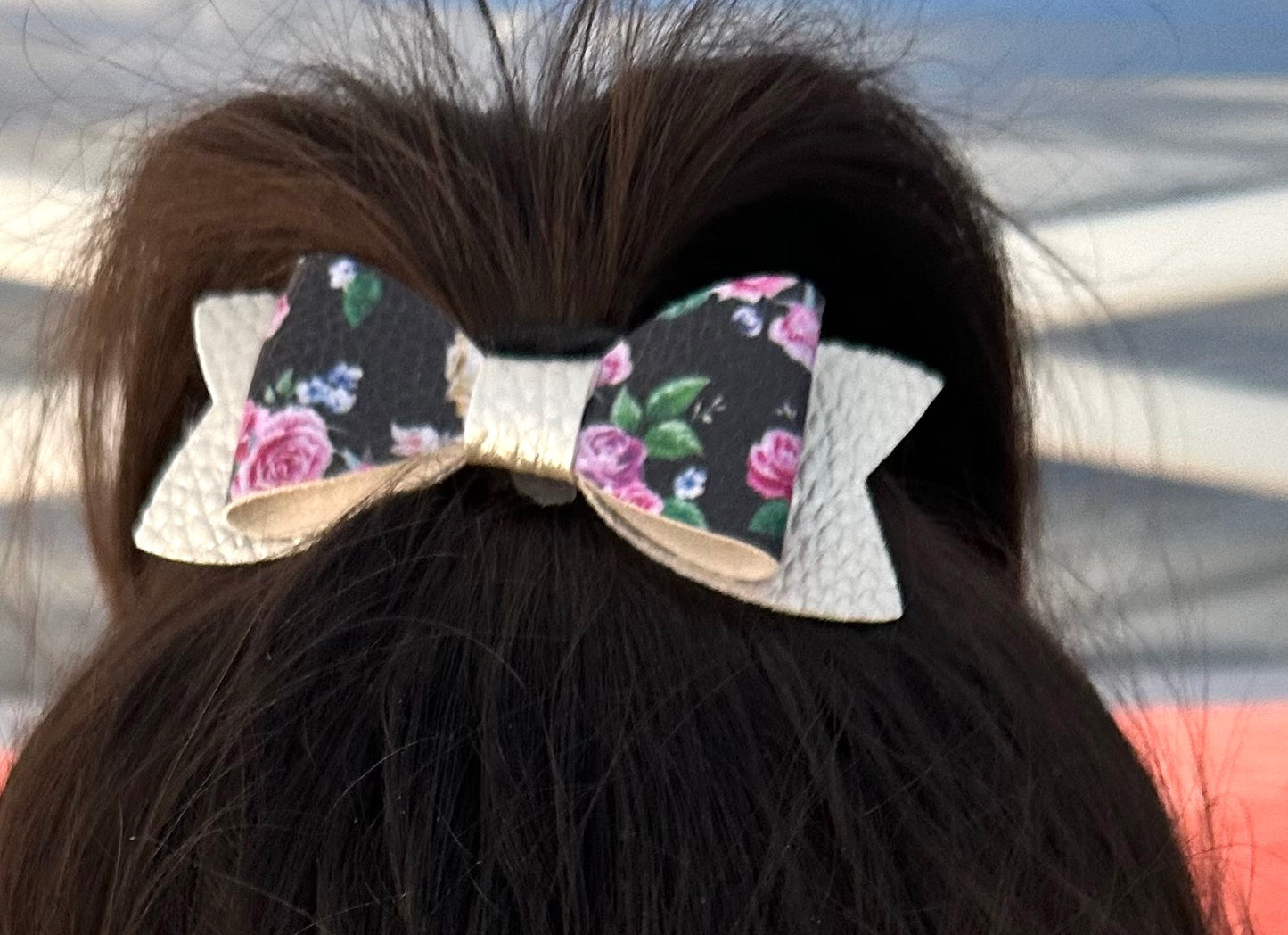 Roses on black and silver bow