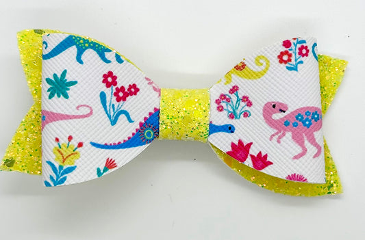 Multicolored Dinosaurs on yellow glitter hair bow