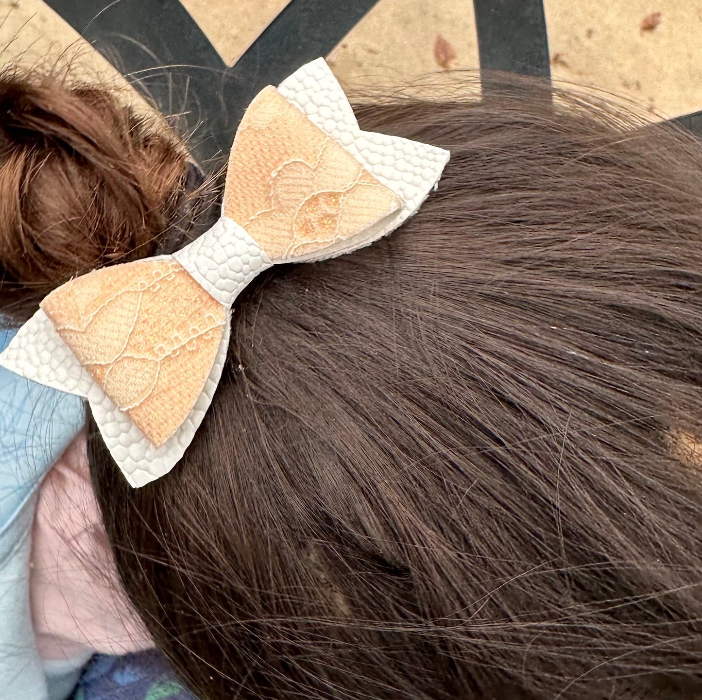 Orange lace on white hair bow