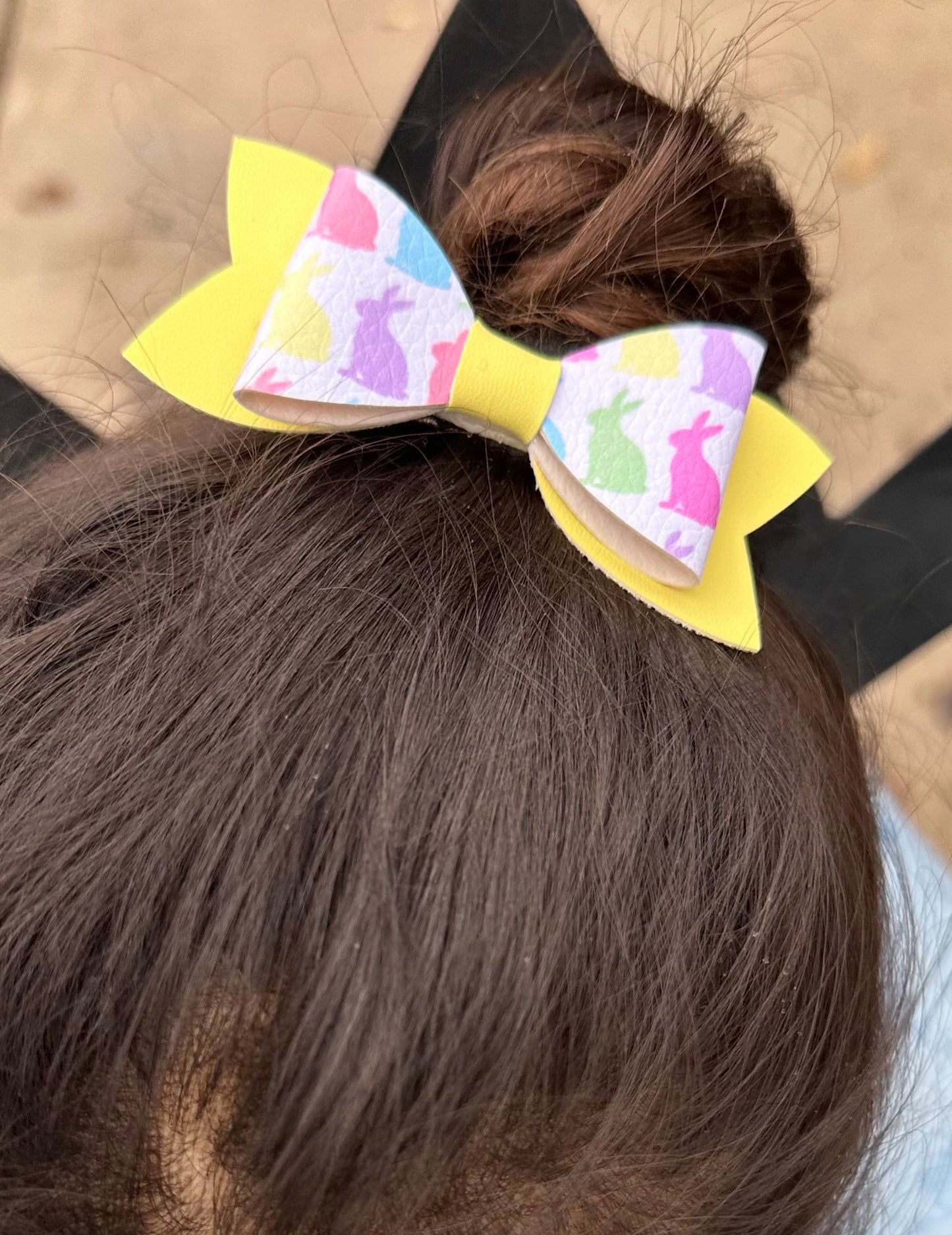 Pastel bunnies on yellow bow