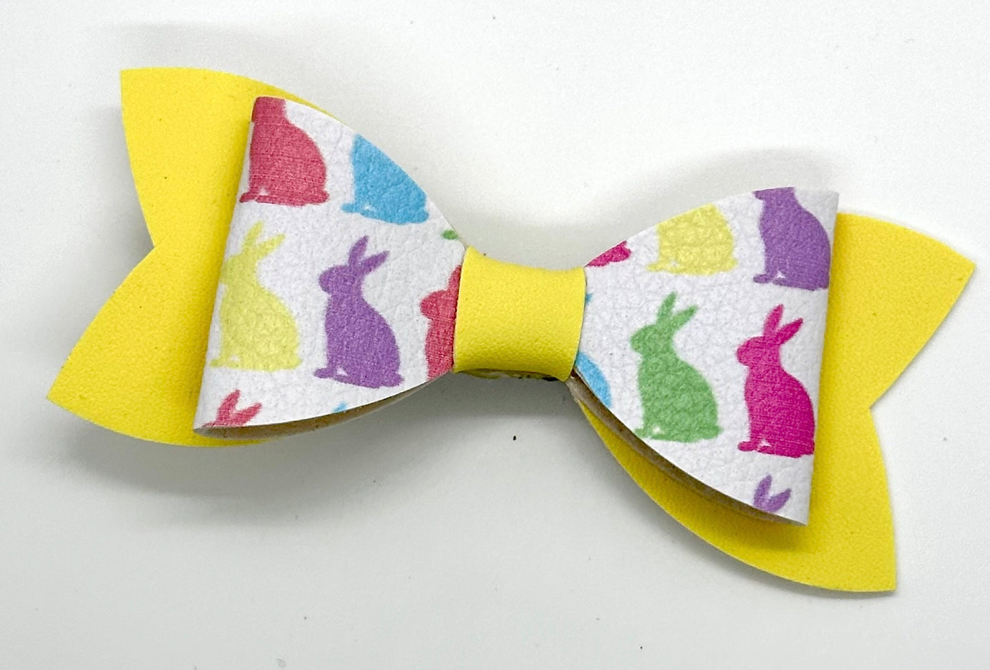 Pastel bunnies on yellow bow