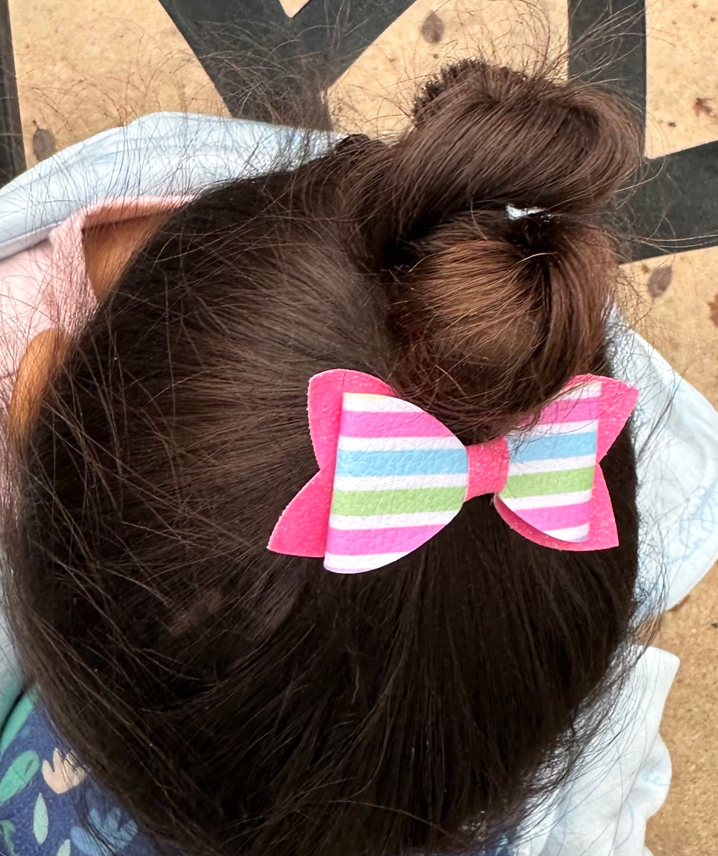 Pastel stripes on pink glitter bow