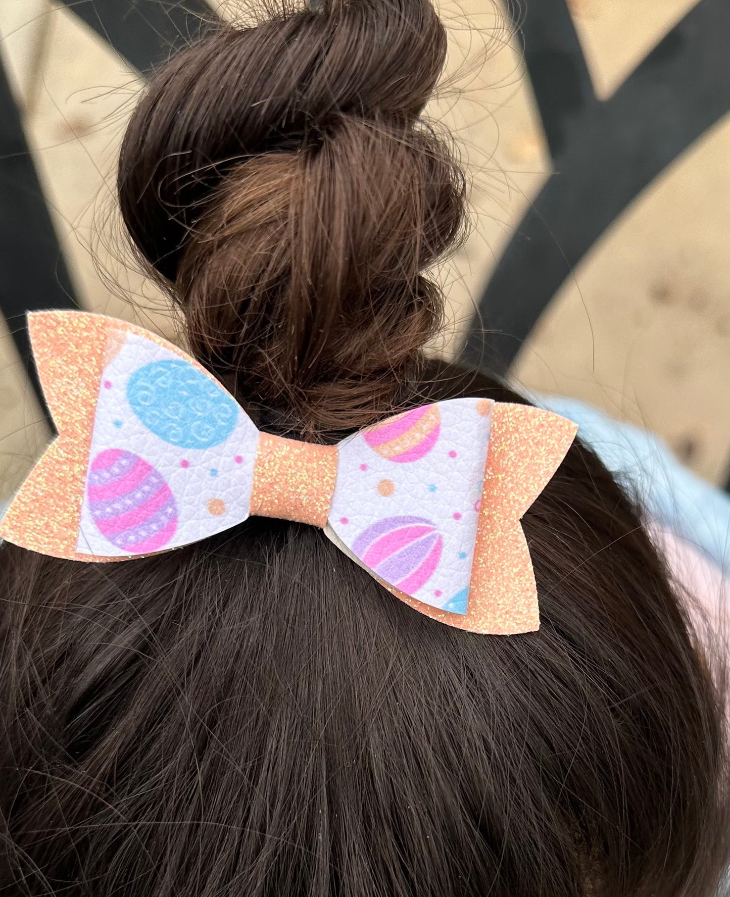 Easter egg on orange glitter bow