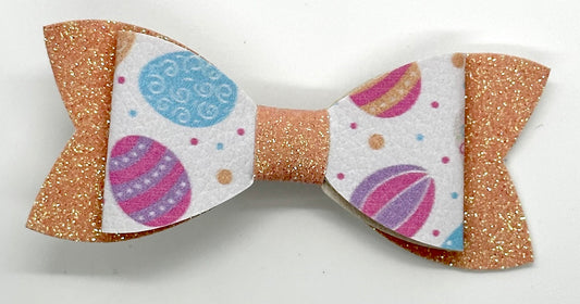 Easter egg on orange glitter bow