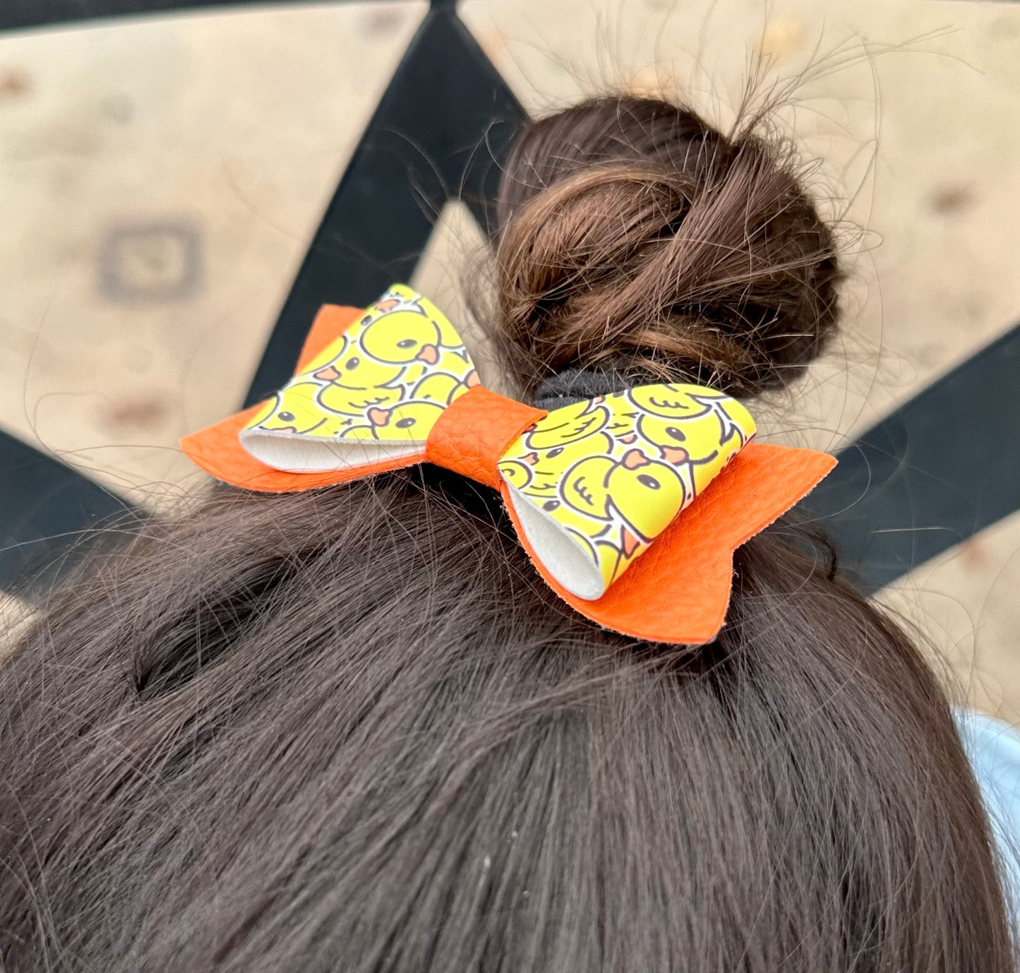 Ducks on orange bow