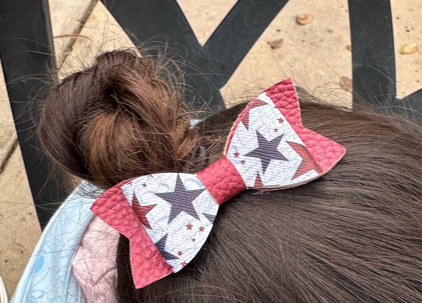 Patriotic stars on shiny red bow