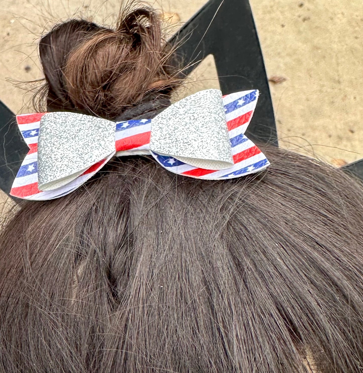 Silver glitter on red white and blue striped bow