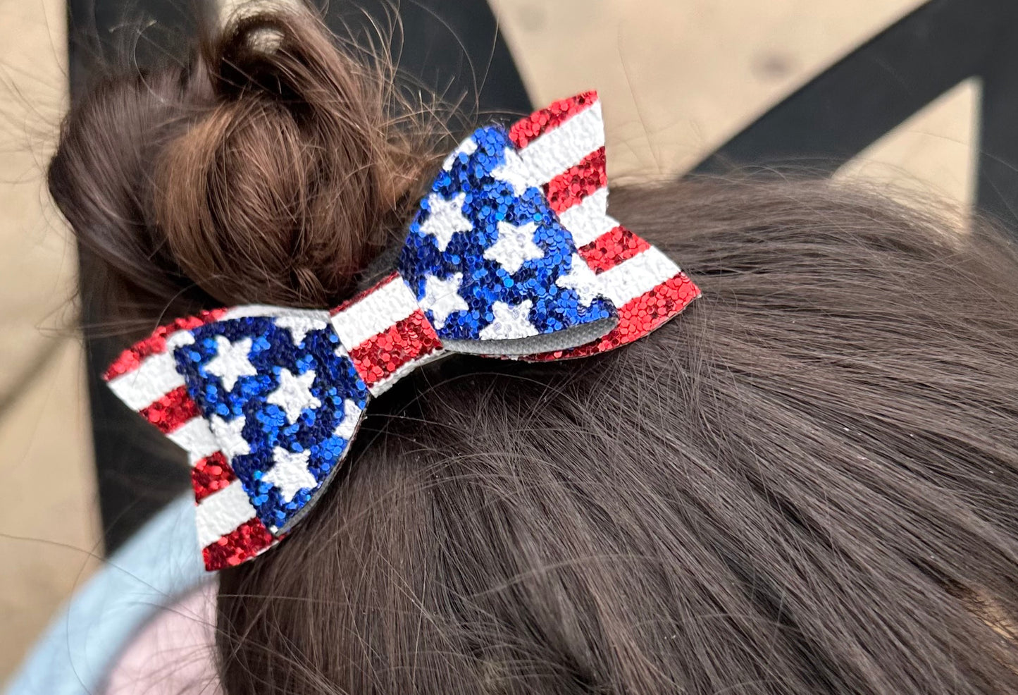 Blue with white stars on red and white stripes glitter bow