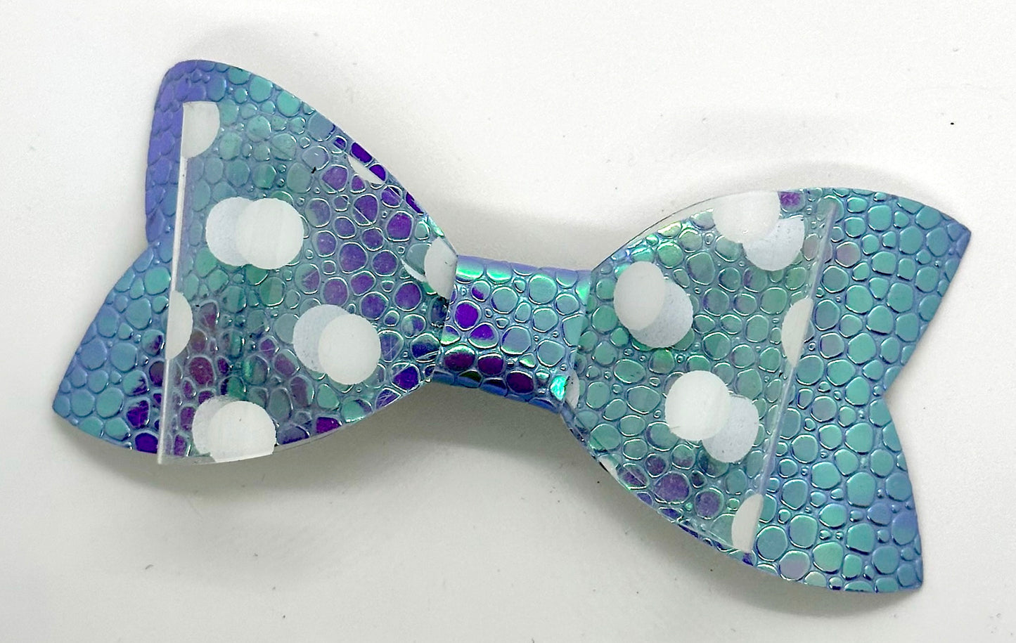 White polka dots on holographic purple scales bow