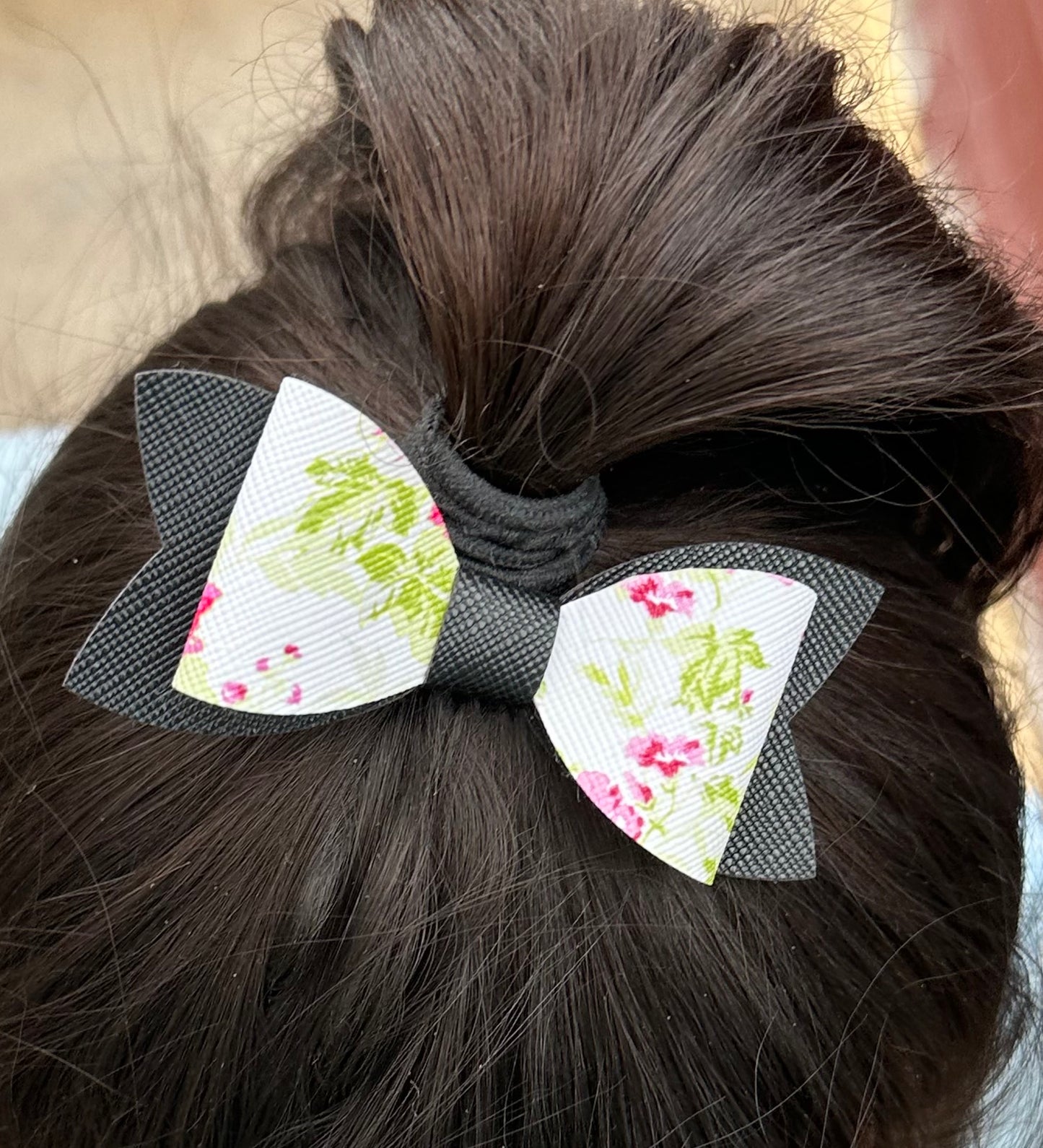 Pink flowers on black bow