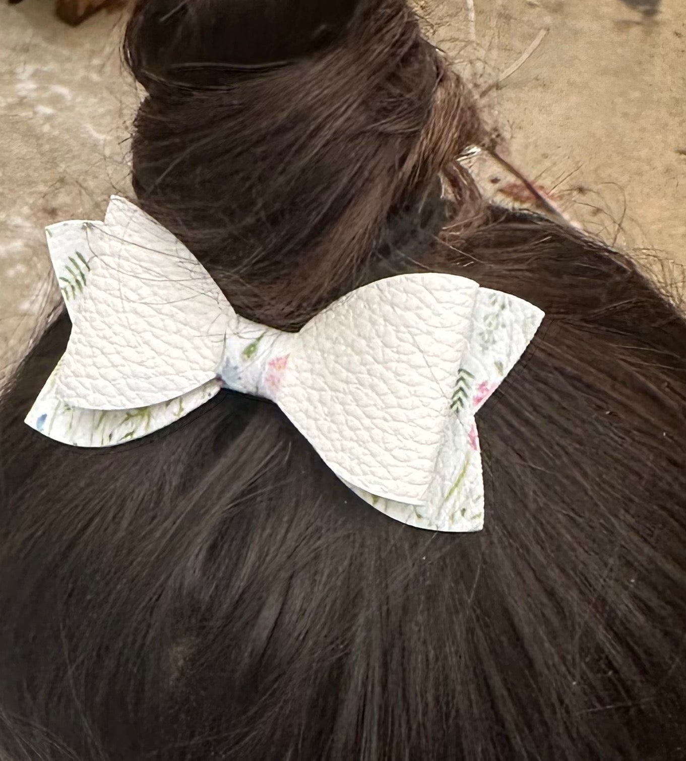 White bow with flowers