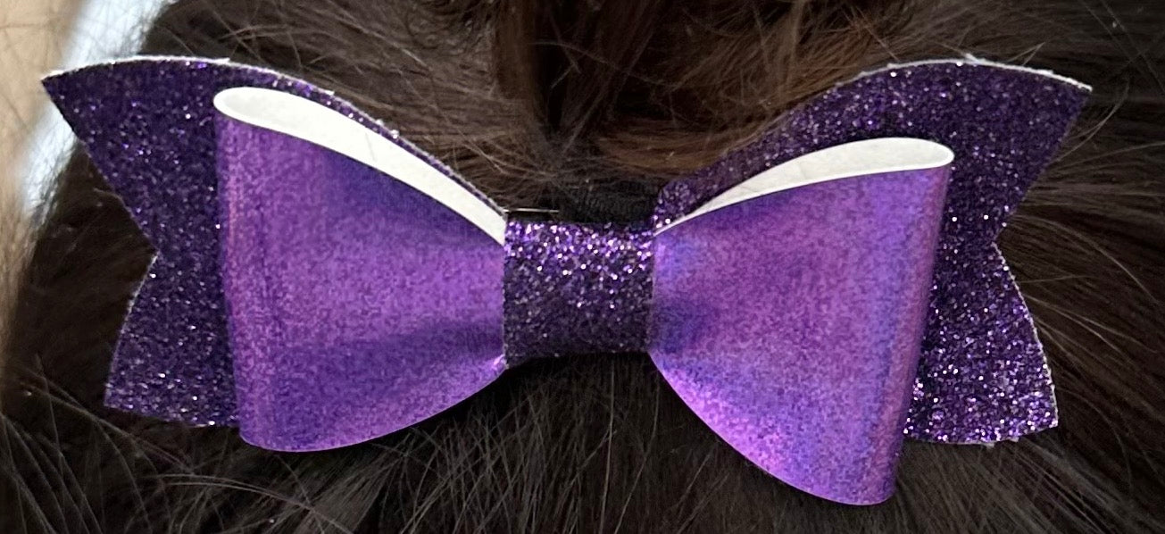 Purple glitter vinyl on glitter bow