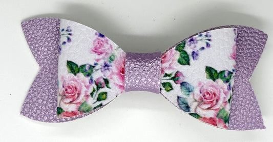 Purple roses on metallic bow