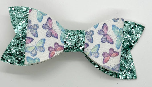 Pastel butterflies on green glitter bow