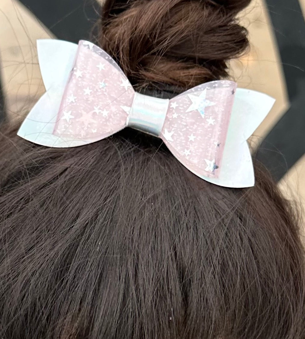 Silver stars on pink on holographic bow